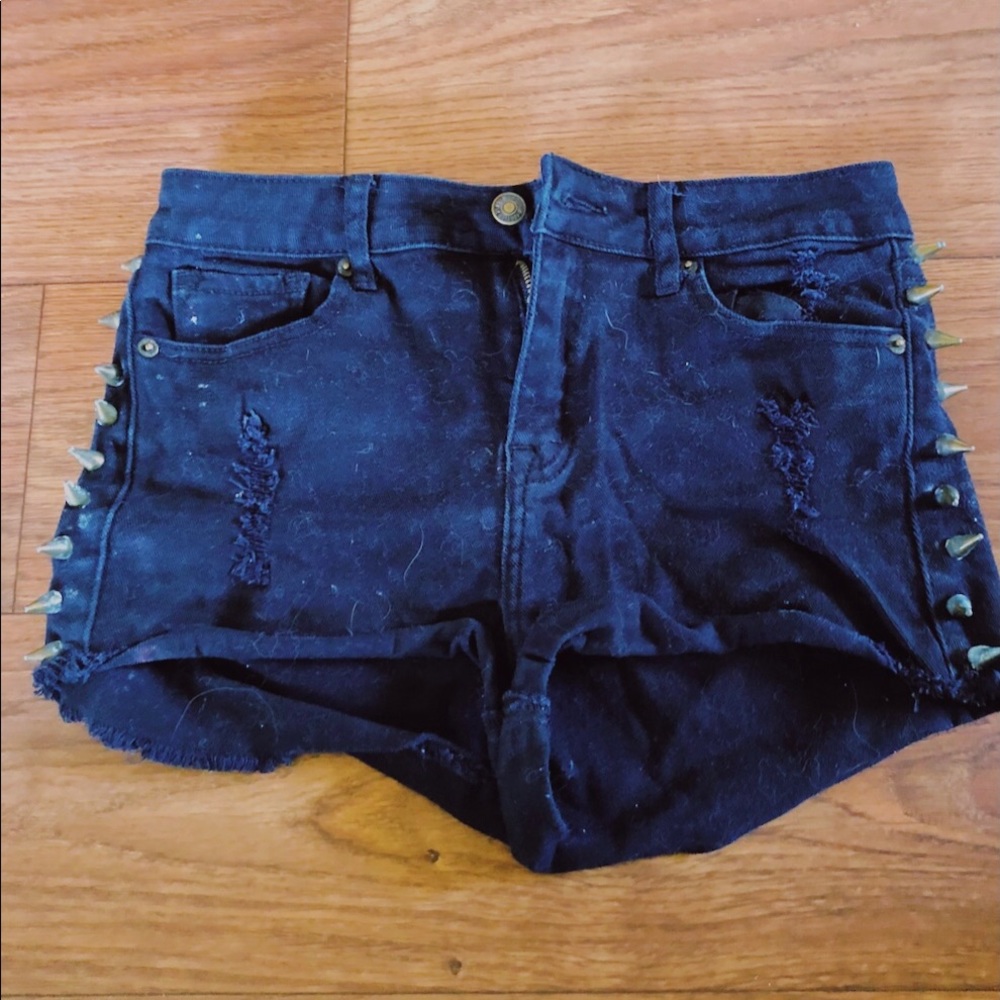 black spike shorts